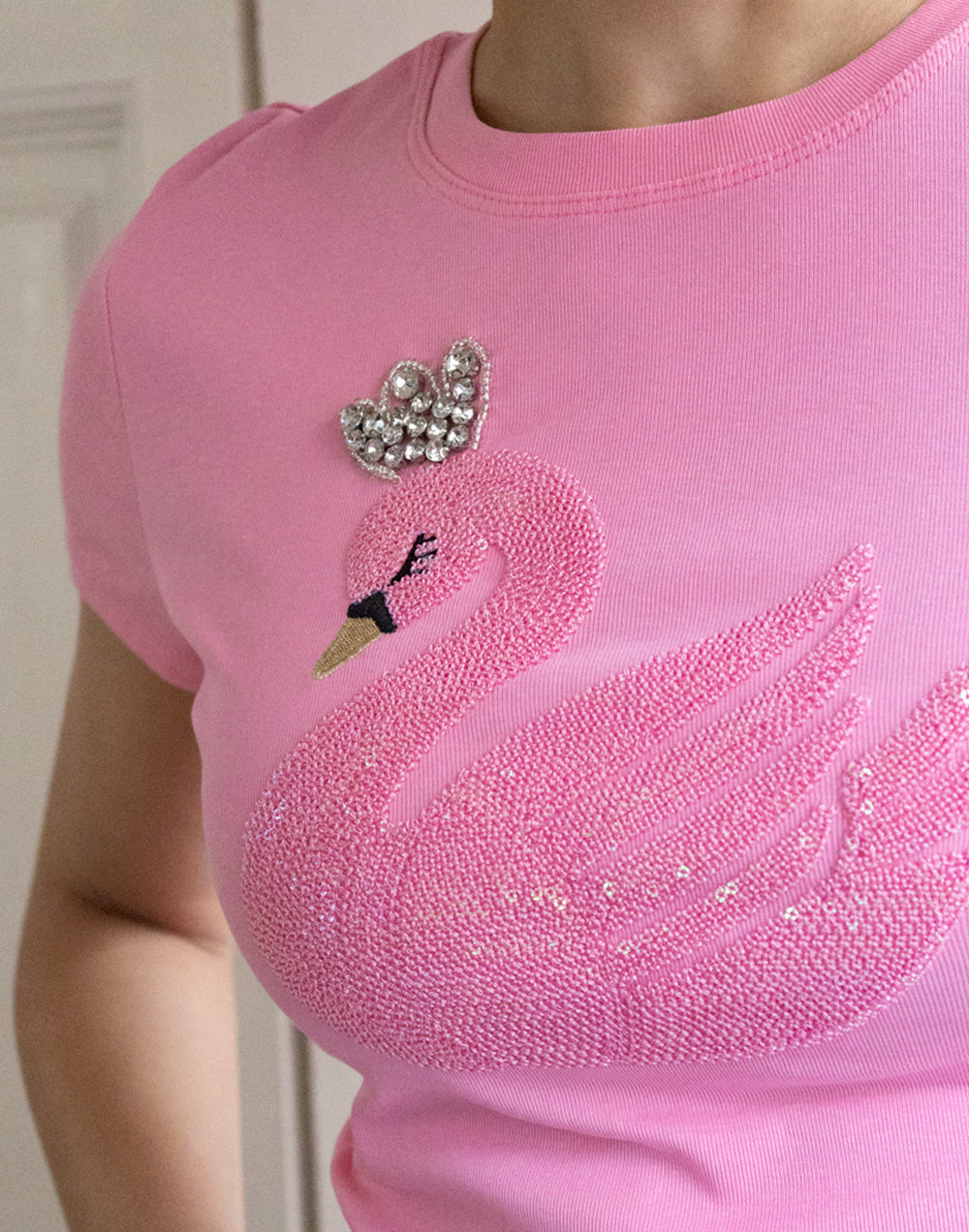 Camiseta cisne de lentejuelas rosa muestrarios de ropa y moda de mujer vestir bien con talla grande plus