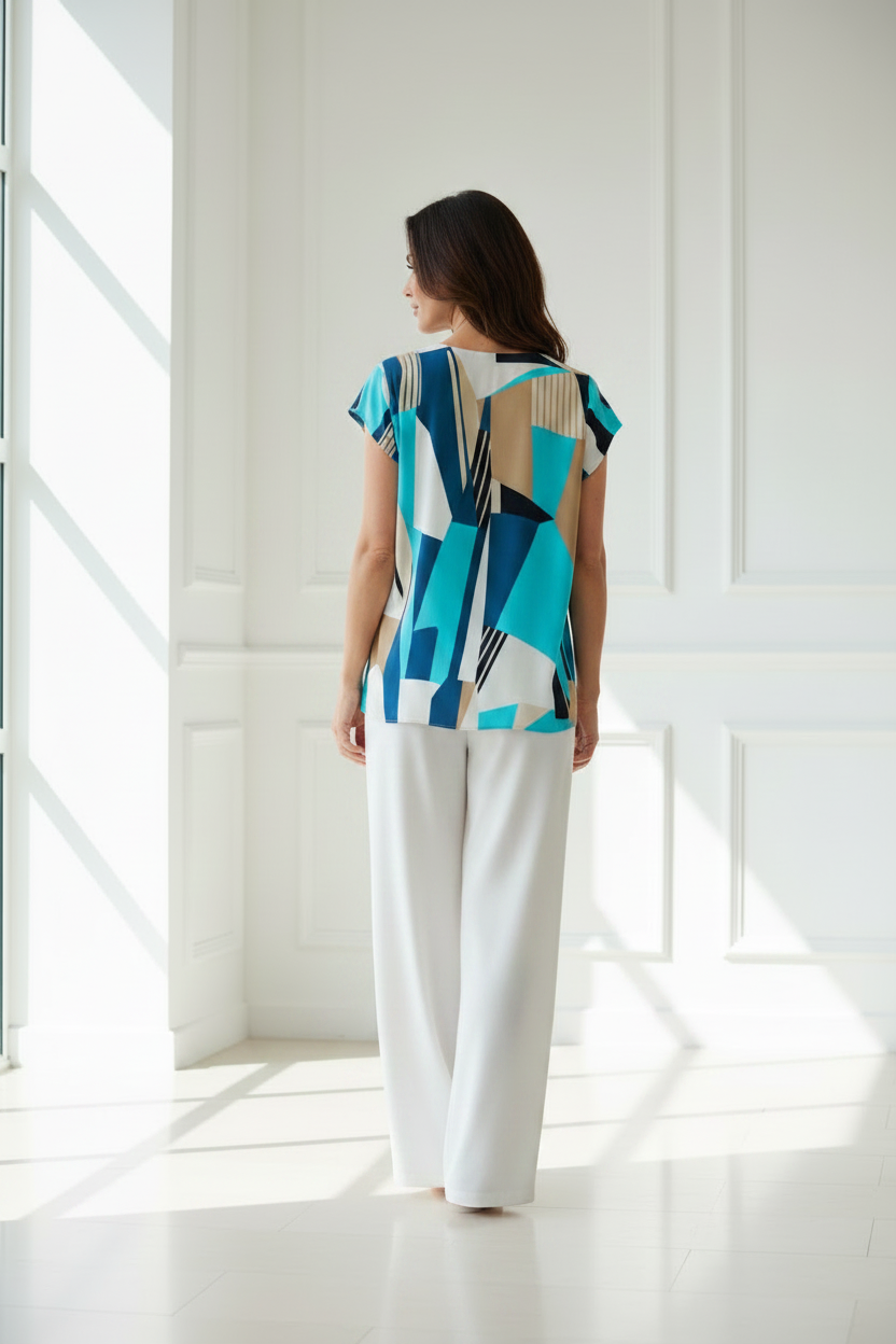Blusa geométrica turquesa vista trasera